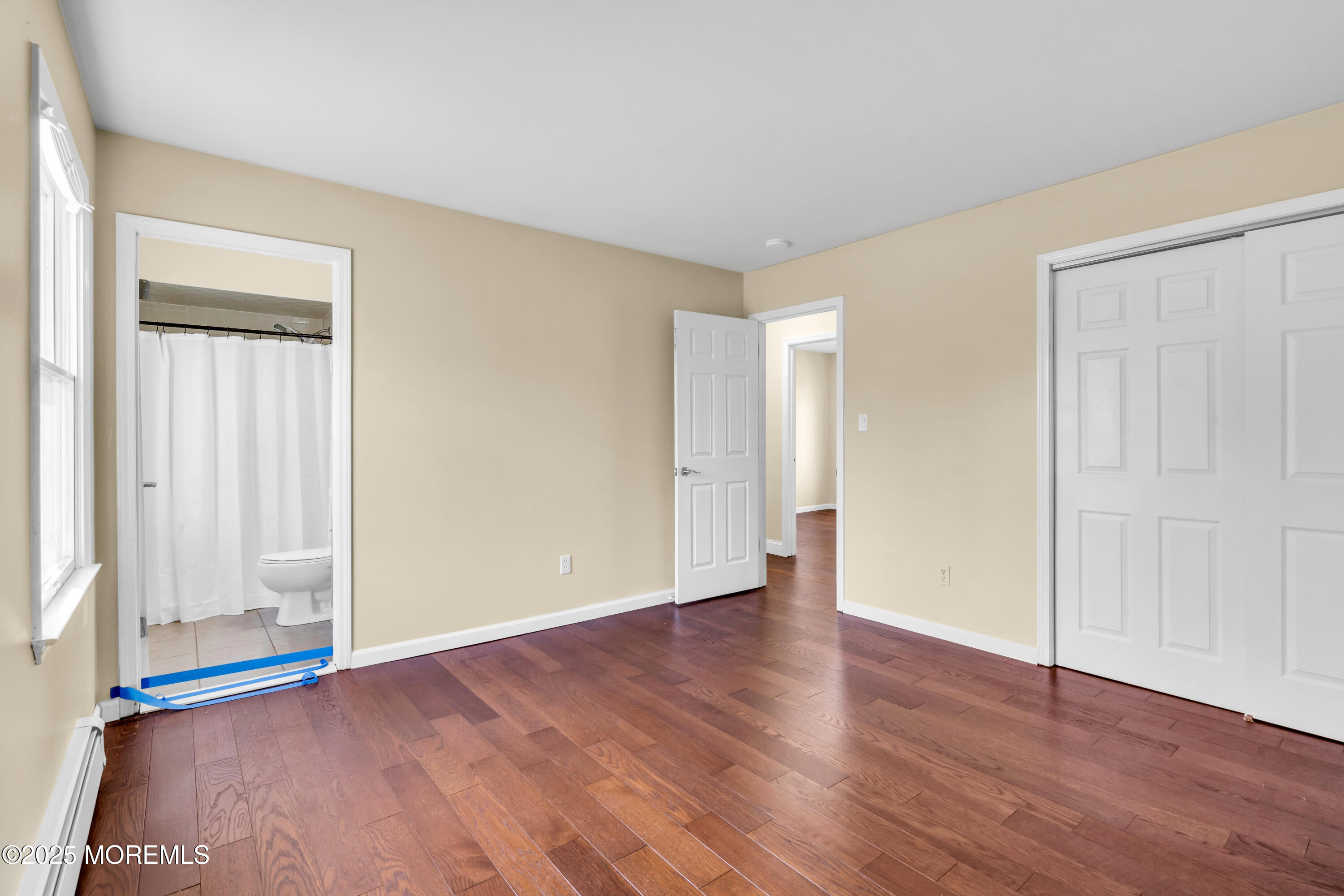 1612 Beverly Road Forked River, NJ 08731 - Photo 16 of 38 a view of an empty room with wooden floor