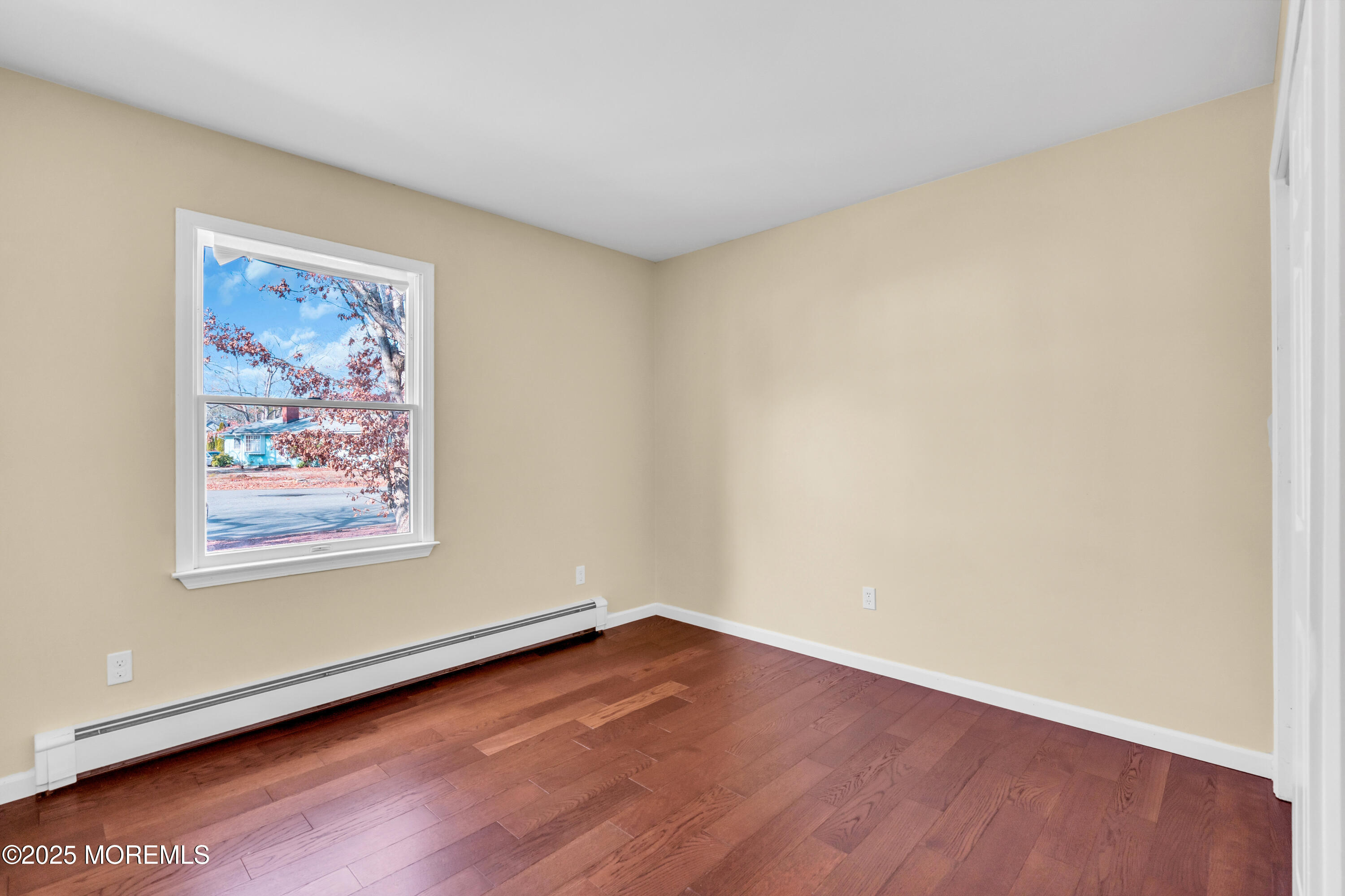 1612 Beverly Road Forked River, NJ 08731 - Photo 18 of 38 an empty room with a workspace and a window