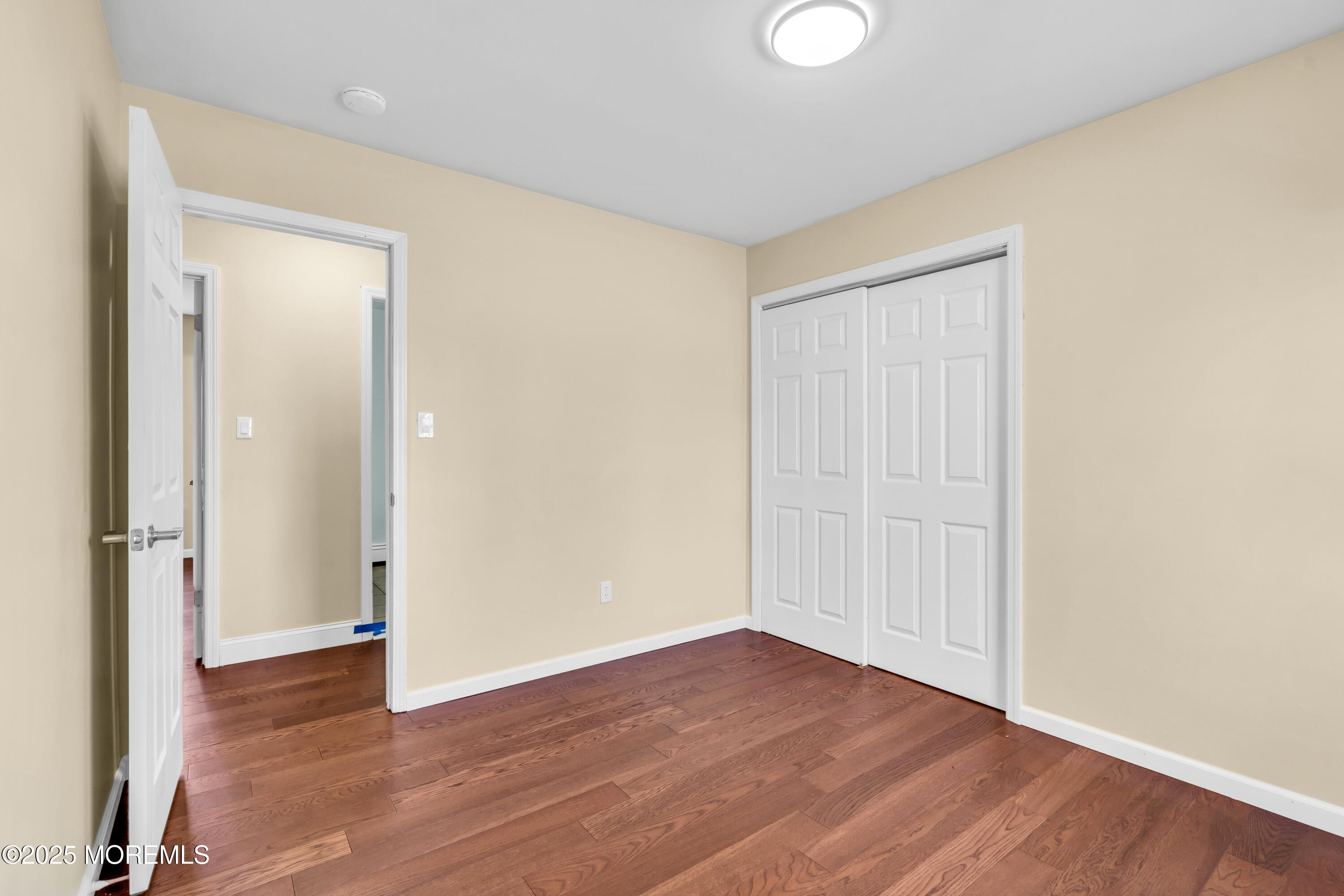 1612 Beverly Road Forked River, NJ 08731 - Photo 21 of 38 a view of an empty room with wooden floor and closet
