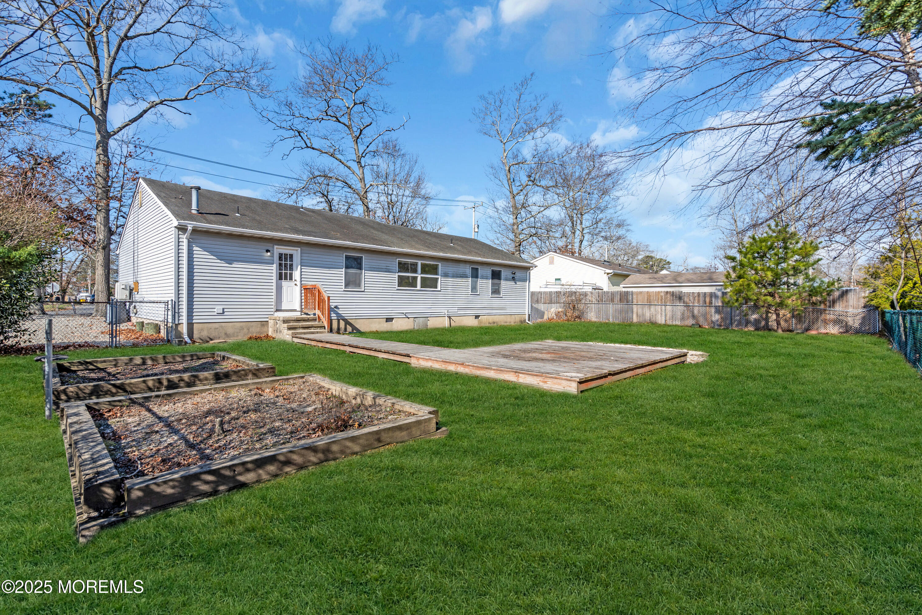 1612 Beverly Road Forked River, NJ 08731 - Photo 23 of 38 a view of a house with a yard porch and sitting area