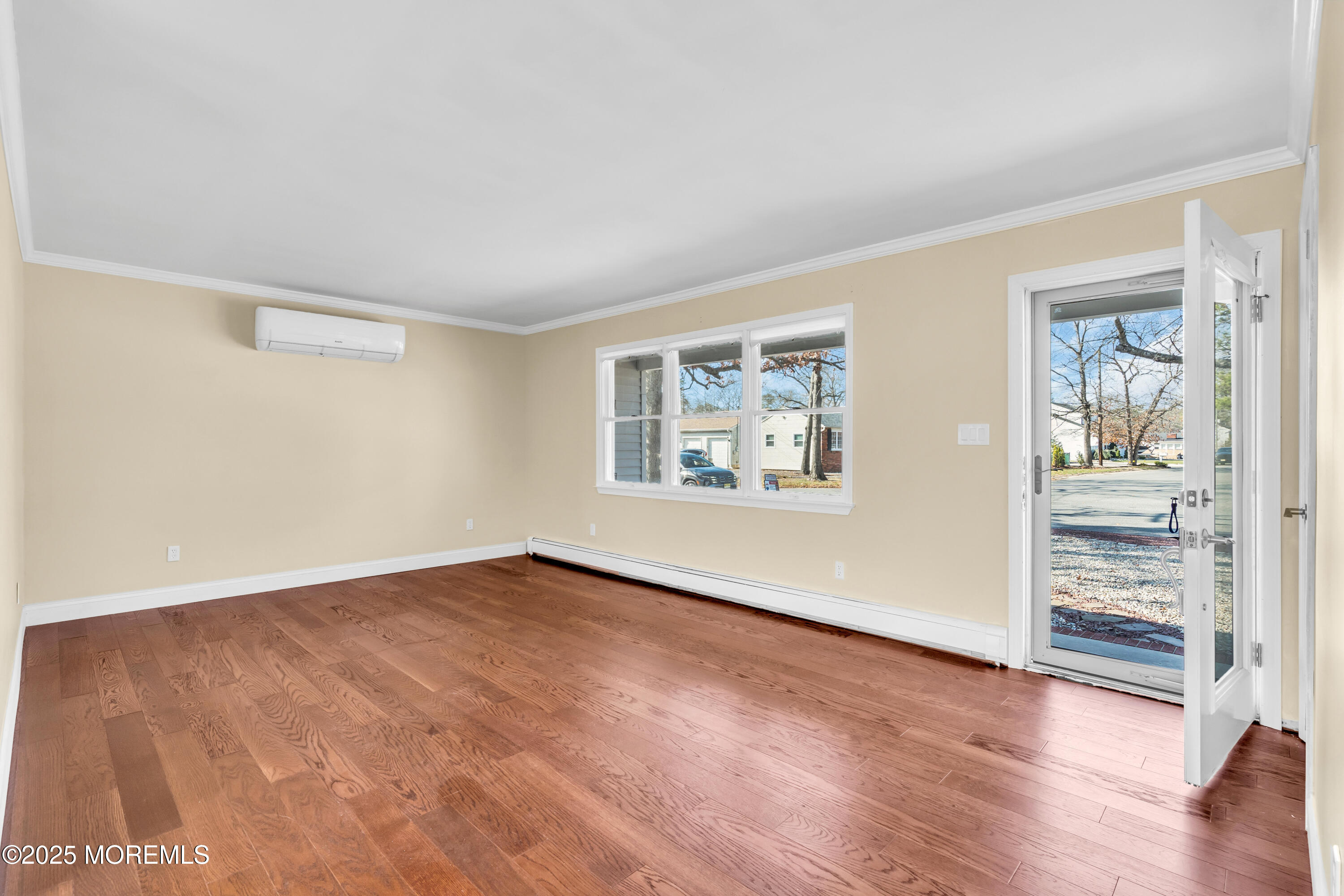 1612 Beverly Road Forked River, NJ 08731 - Photo 5 of 38 an empty room with wooden floor closet and windows