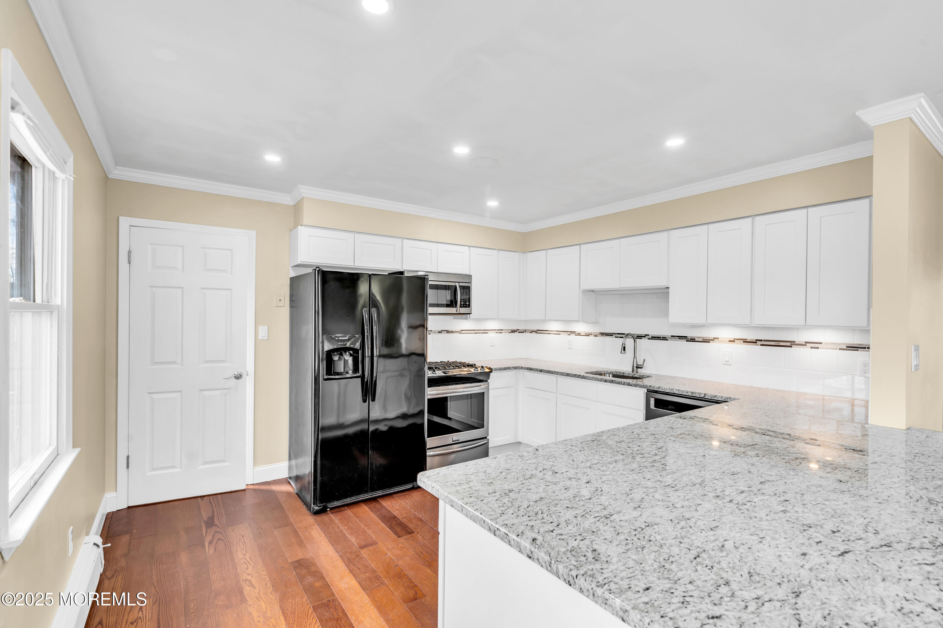1612 Beverly Road Forked River, NJ 08731 - Photo 9 of 38 a kitchen with a refrigerator and a sink