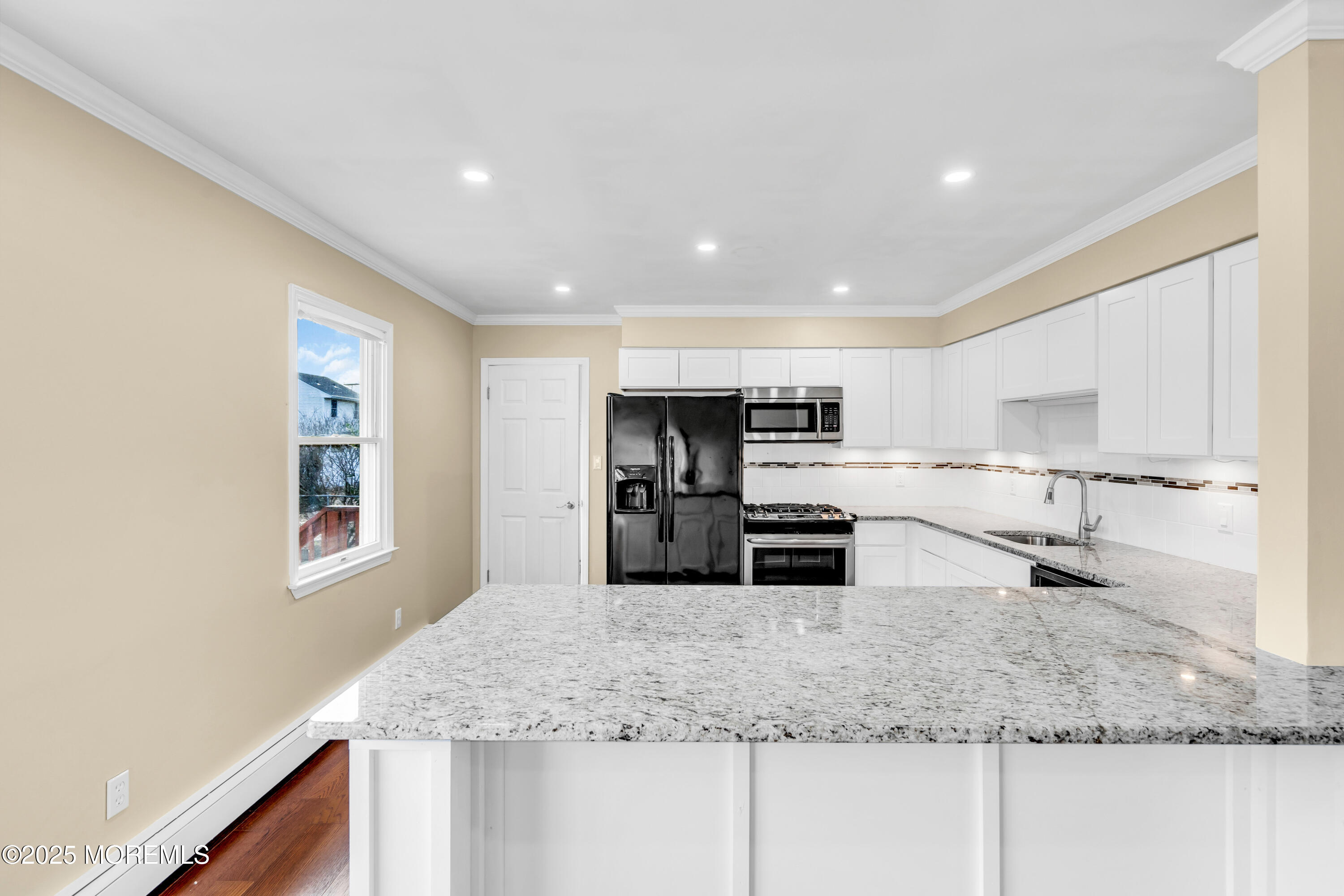 1612 Beverly Road Forked River, NJ 08731 - Photo 10 of 38 a kitchen with stainless steel appliances granite countertop a sink stove and refrigerator