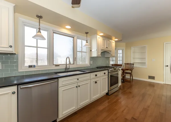 a kitchen with lots of counter top space and window
