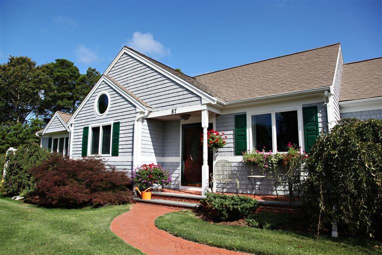 87 Cairn Ridge Road East Falmouth, MA 02536 - Photo 1 of 34 a front view of a house with a yard