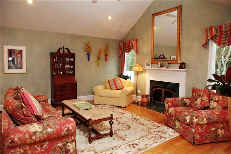 87 Cairn Ridge Road East Falmouth, MA 02536 - Photo 3 of 34 a living room with furniture and a fireplace