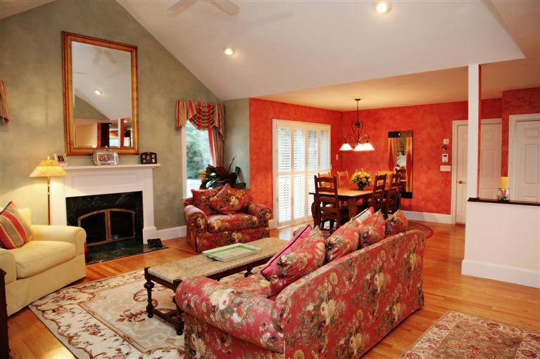 87 Cairn Ridge Road East Falmouth, MA 02536 - Photo 5 of 34 a living room with furniture fireplace and mirror