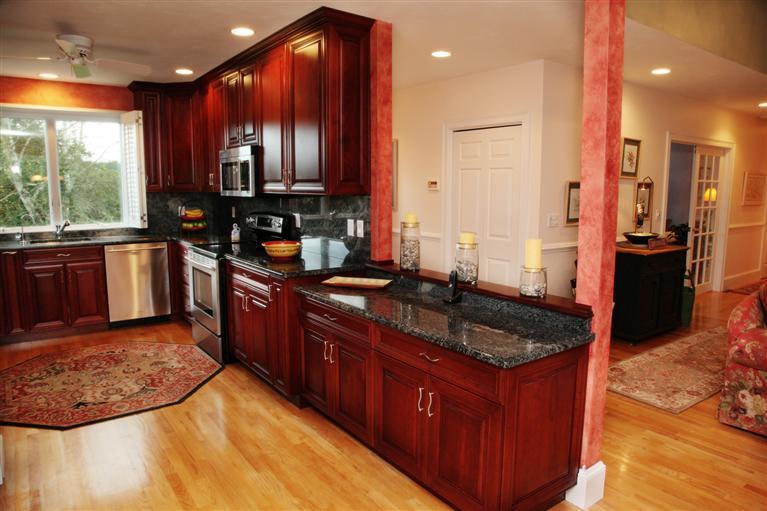 87 Cairn Ridge Road East Falmouth, MA 02536 - Photo 6 of 34 a kitchen with stainless steel appliances granite countertop a stove a sink and a refrigerator