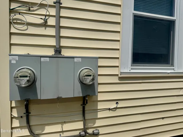 a view of storage and utility room with a bench