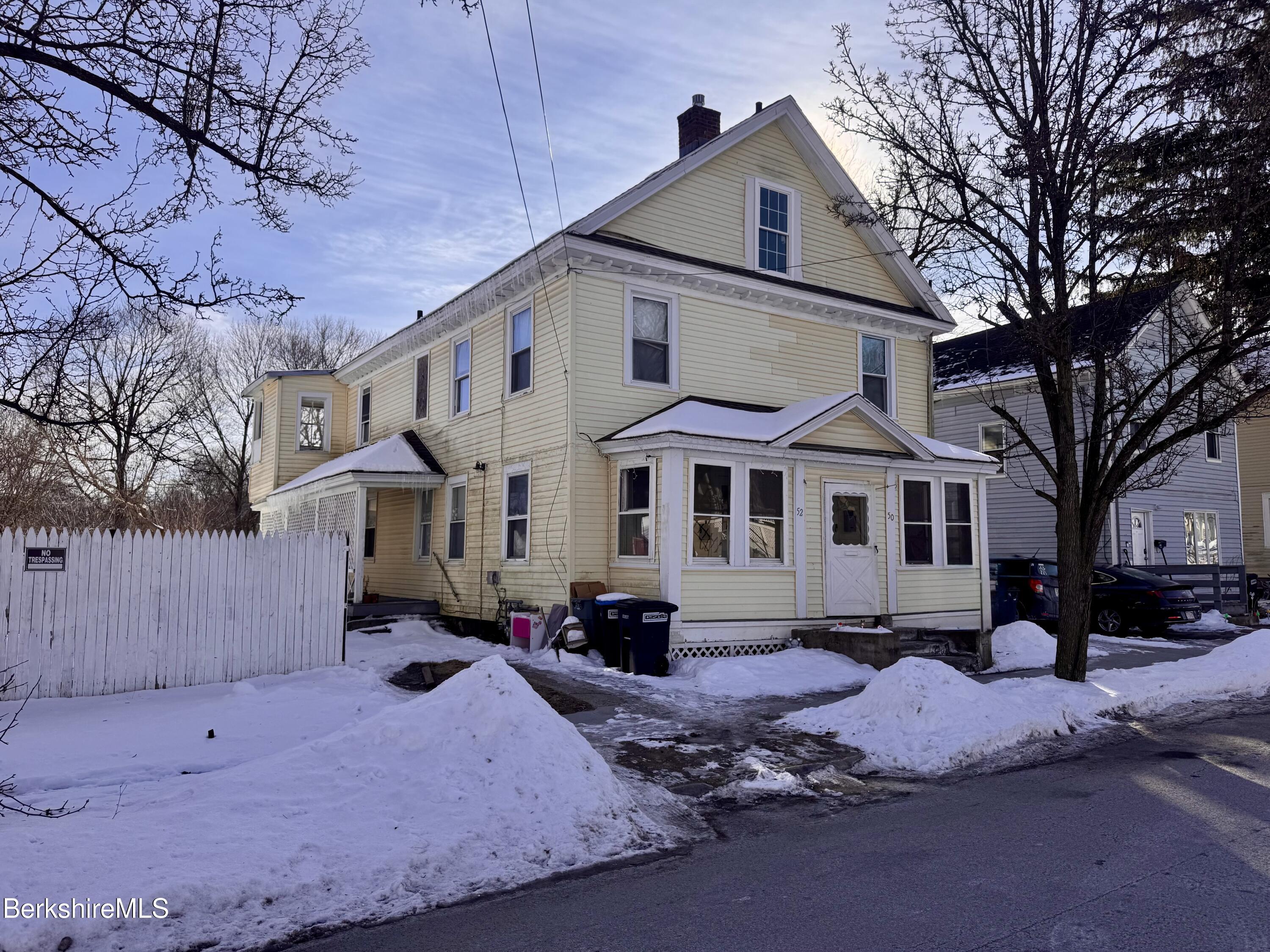 50-52 John Street Pittsfield, MA 01201 - Photo 2 of 25 a front view of a house with a yard