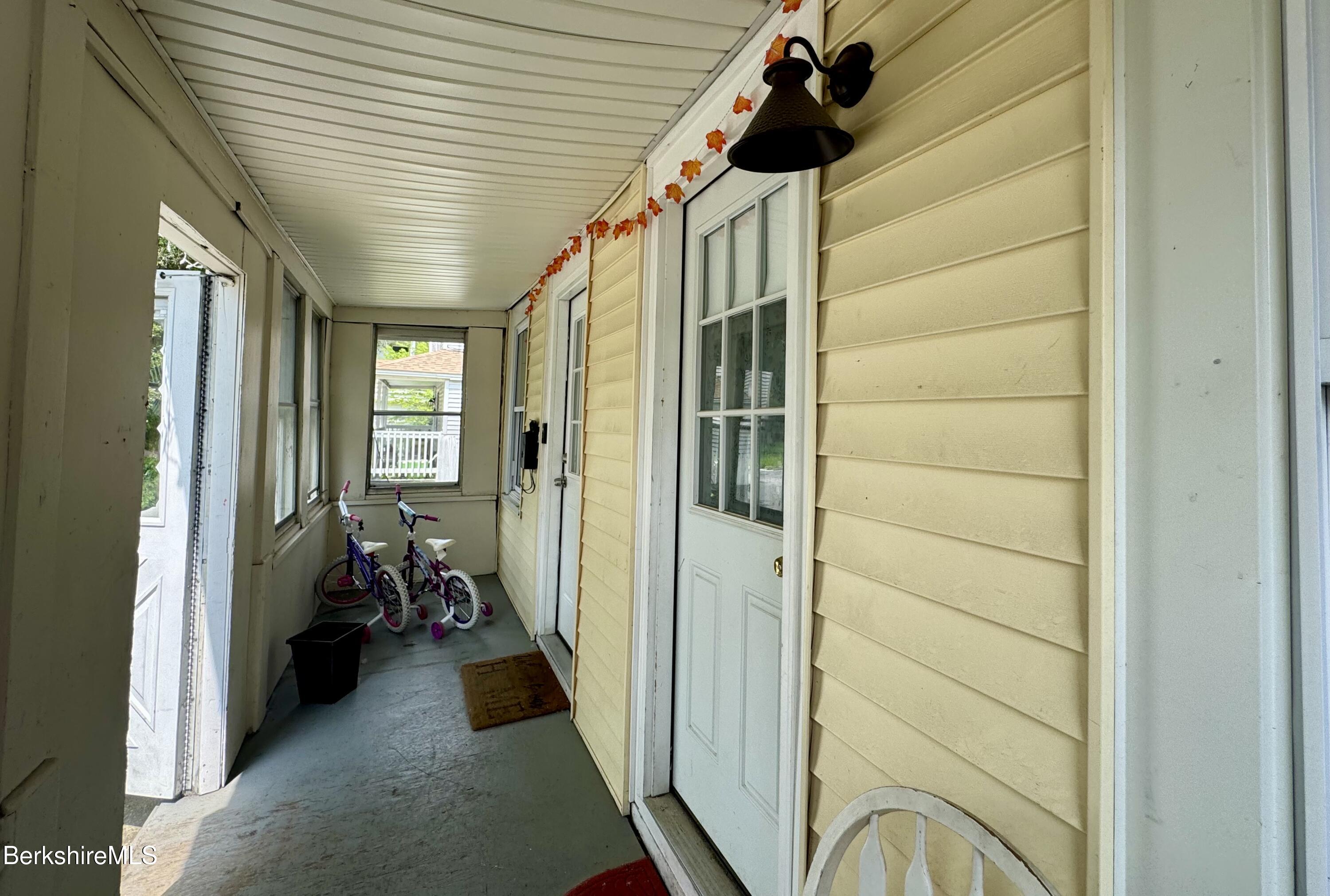 50-52 John Street Pittsfield, MA 01201 - Photo 5 of 25 a view of hallway with livingroom and furniture