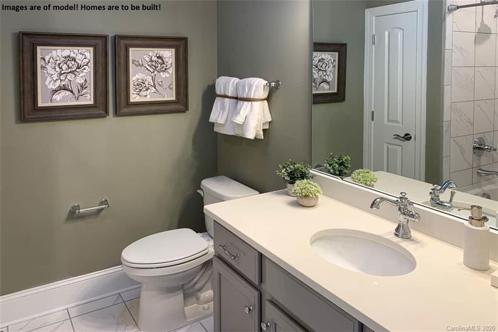 2069 New Style Way, Unit 32 Tega Cay, SC 29708 - Photo 10 of 30 a bathroom with a toilet sink and mirror