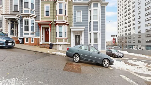 a view of a car parked in front of a building