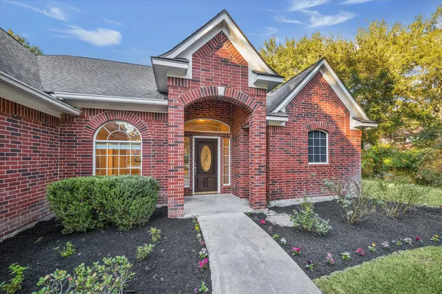 a front view of a house with garden