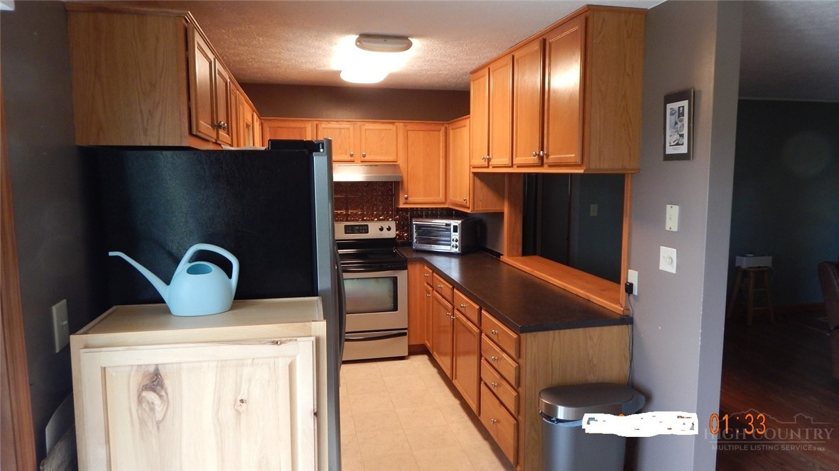 190 Kings Road Boone, NC 28607 - Photo 6 of 15 a kitchen with a refrigerator and a stove