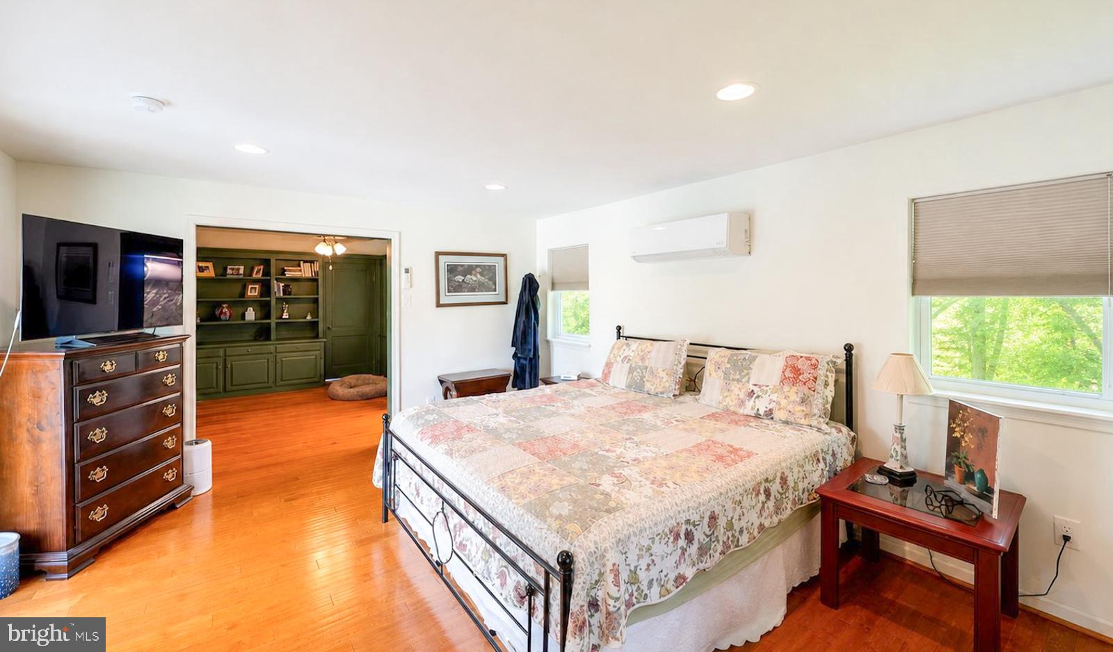 222 Blue School Road Perkasie, PA 18944 - Photo 25 of 77 a bedroom with a bed and a flat screen tv