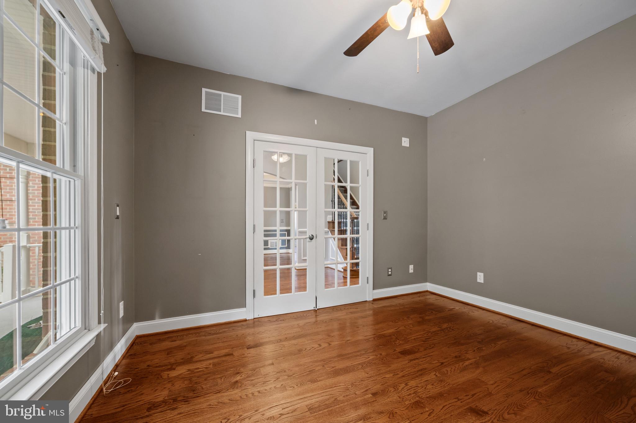 12221 Jerusalem Road Kingsville, MD 21087 - Photo 17 of 66 a view of an empty room with wooden floor and a window