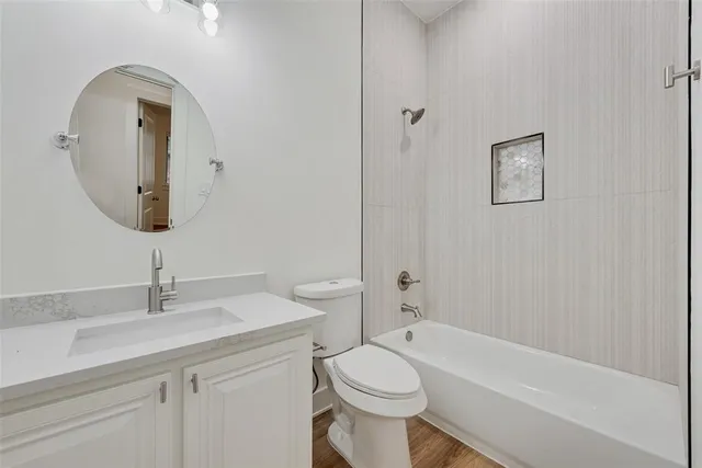 a bathroom with a toilet sink and bathtub