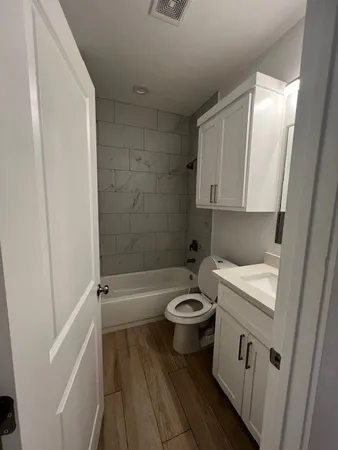 a living room with a wooden floor