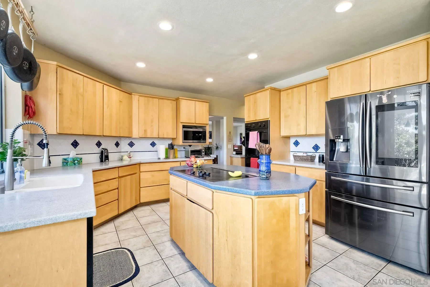 15892 Bent Tree Road Poway, CA 92064 - Photo 14 of 56 a kitchen with stainless steel appliances granite countertop a sink a stove and refrigerator