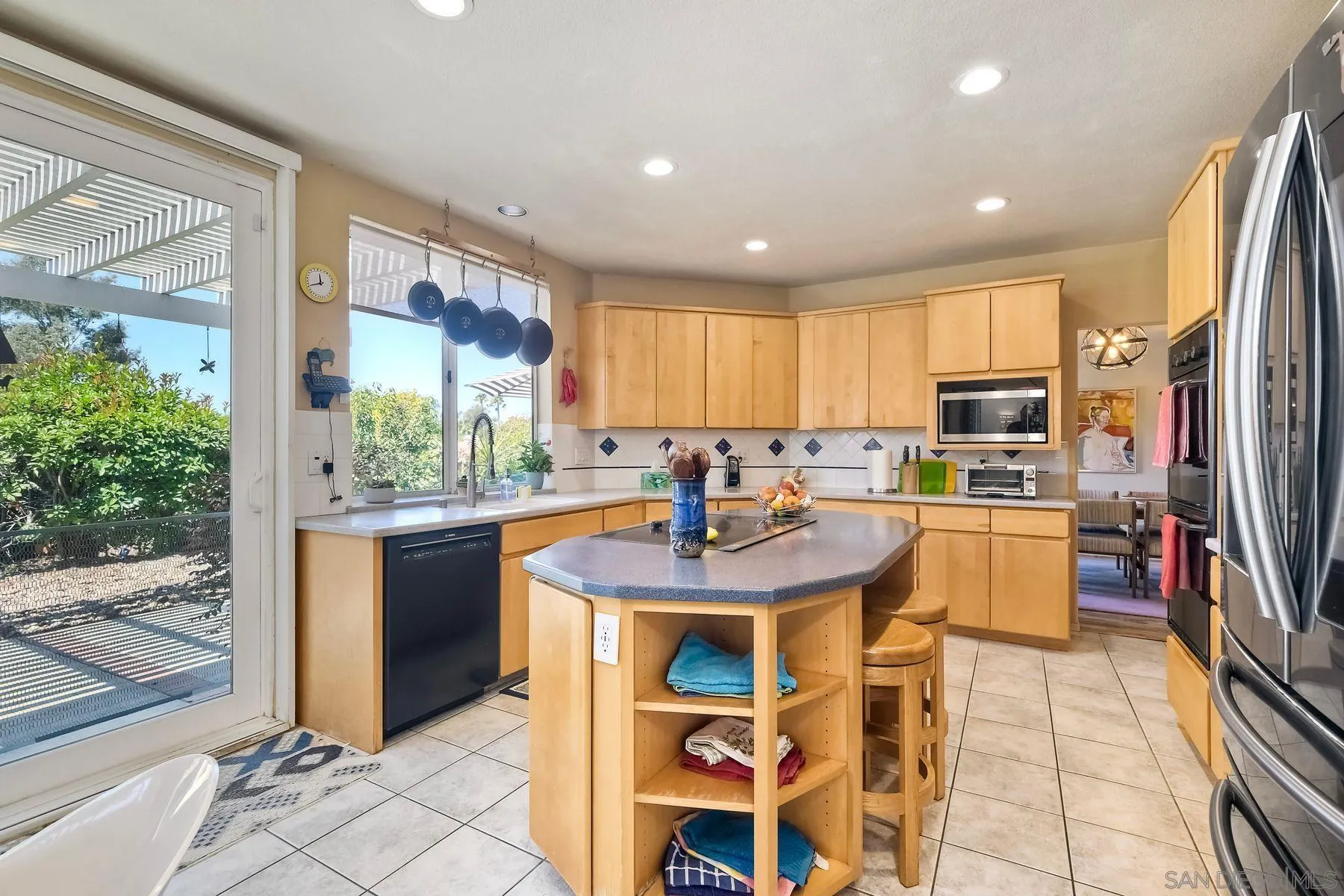 15892 Bent Tree Road Poway, CA 92064 - Photo 15 of 56 a kitchen with stainless steel appliances granite countertop a sink a stove and a refrigerator