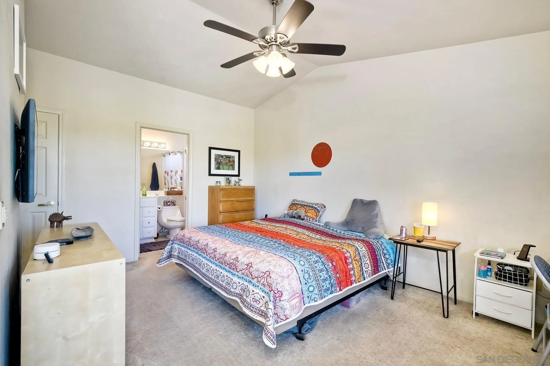 15892 Bent Tree Road Poway, CA 92064 - Photo 18 of 56 a bedroom with a bed and a chandelier
