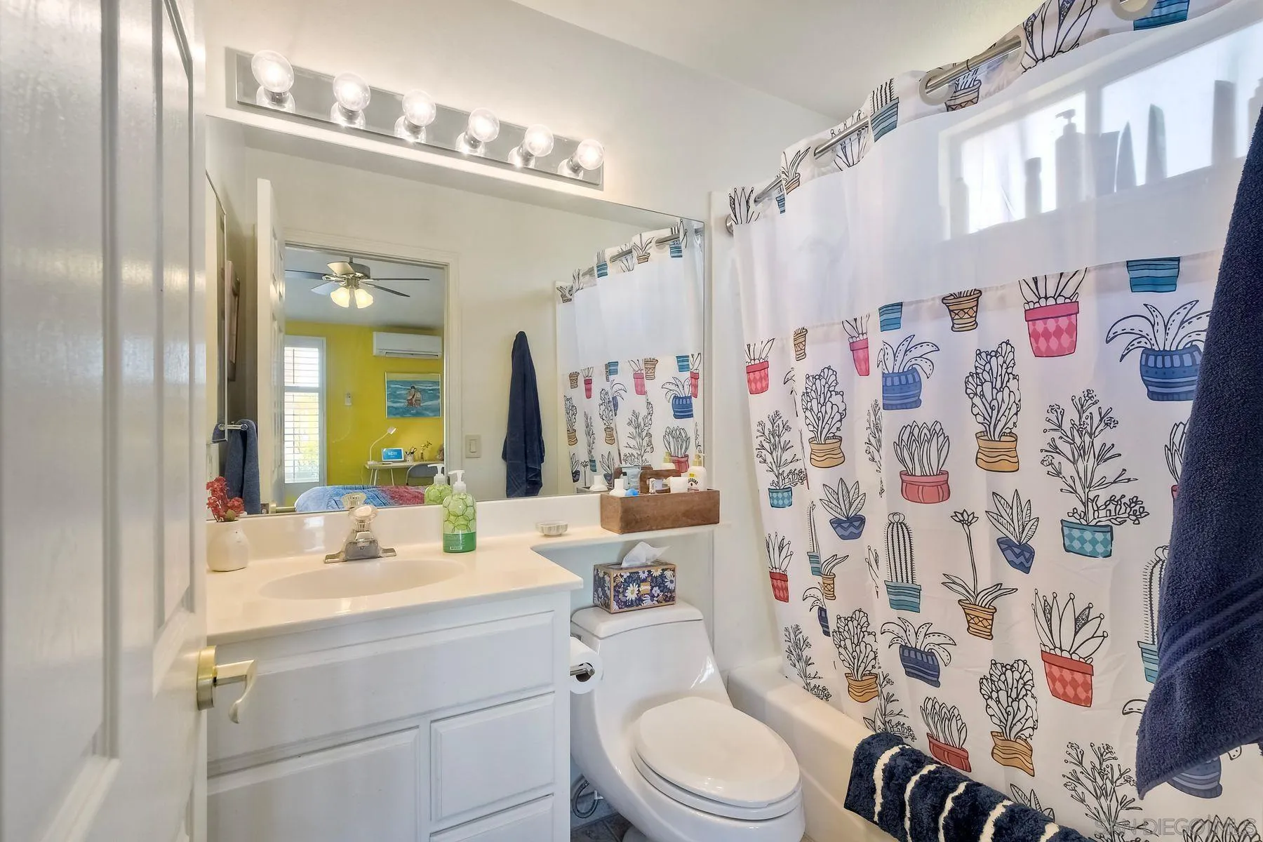15892 Bent Tree Road Poway, CA 92064 - Photo 19 of 56 a bathroom with a sink a toilet and shower curtain