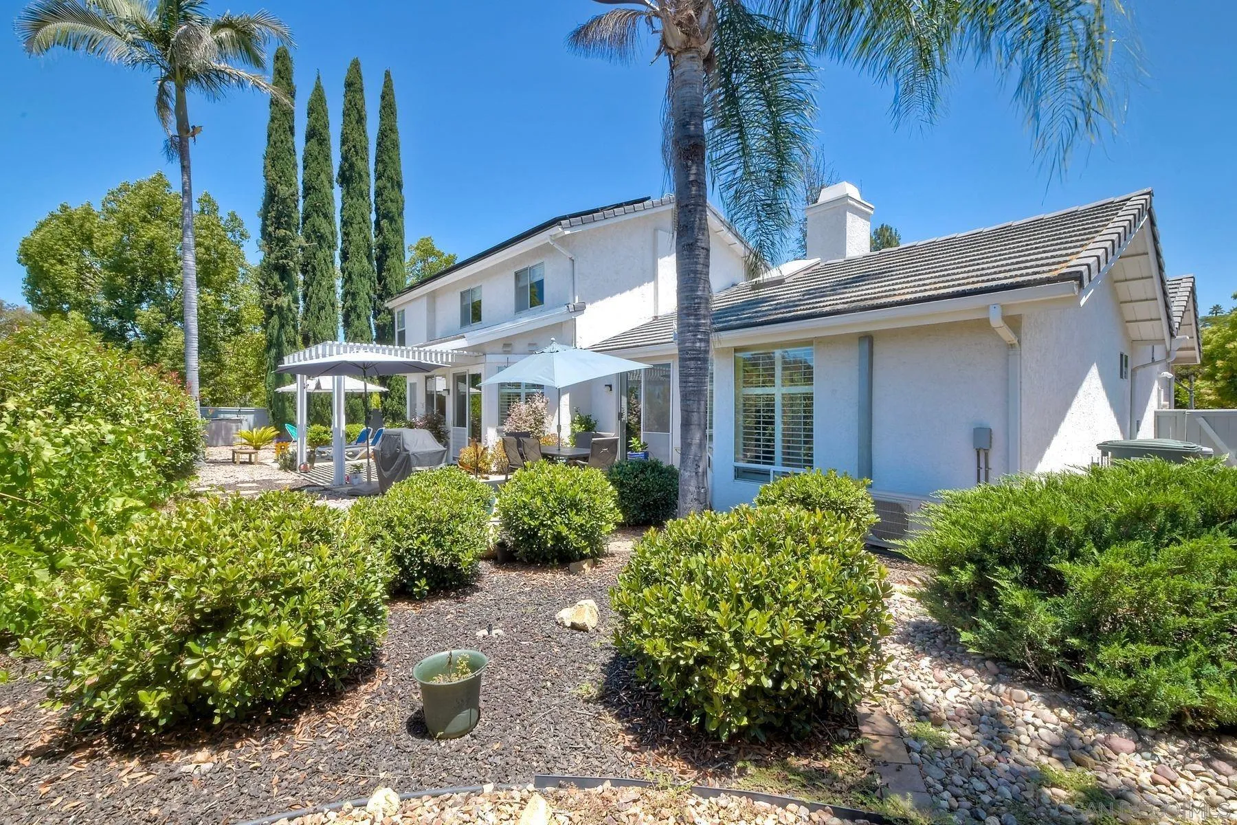 15892 Bent Tree Road Poway, CA 92064 - Photo 2 of 56 a front view of a house with garden