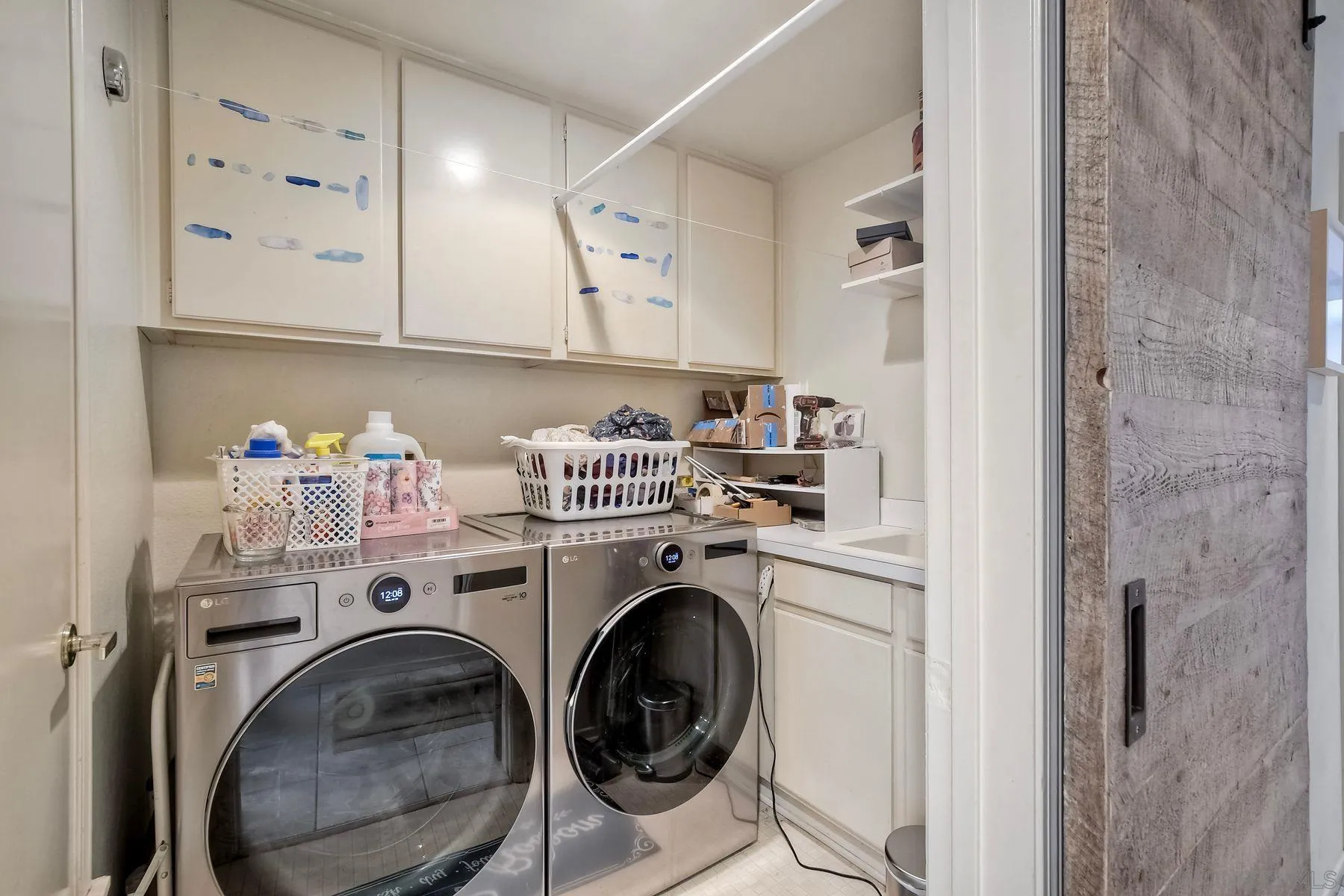 15892 Bent Tree Road Poway, CA 92064 - Photo 22 of 56 a utility room with sink dryer and washer