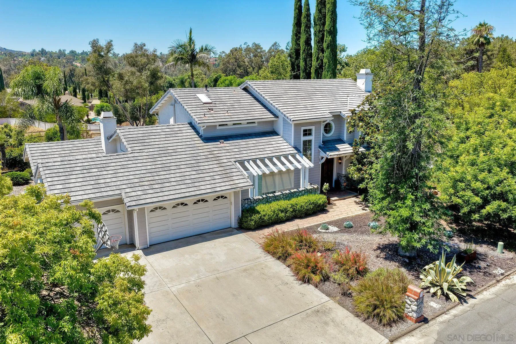 15892 Bent Tree Road Poway, CA 92064 - Photo 39 of 56 a view of a house with a yard and potted plants