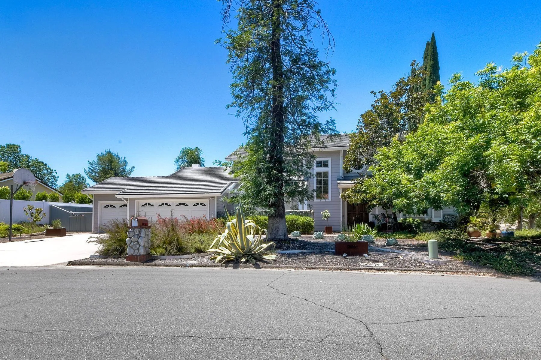 15892 Bent Tree Road Poway, CA 92064 - Photo 56 of 56 a front view of a building with tree s