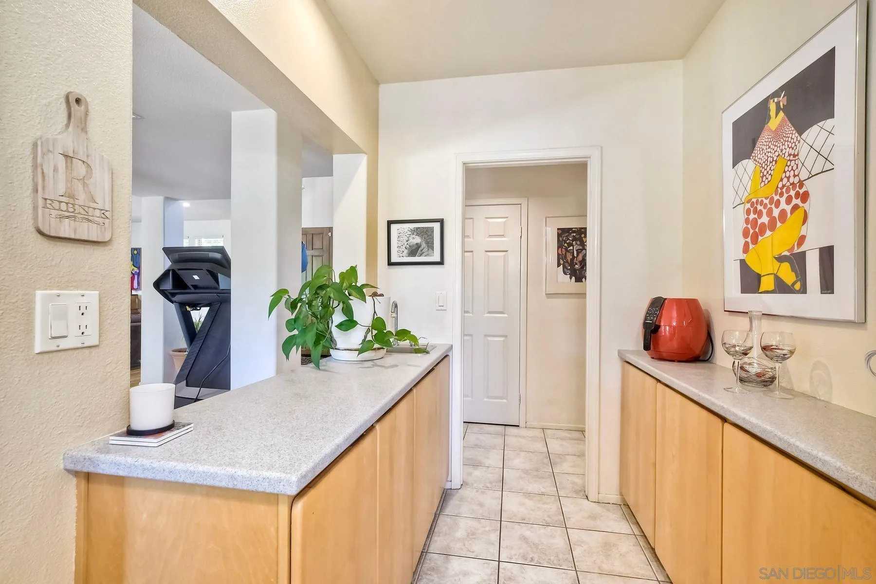 15892 Bent Tree Road Poway, CA 92064 - Photo 10 of 56 a hallway with a sink and potted plant