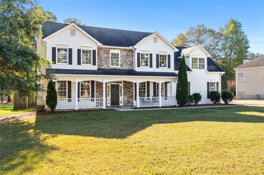 4255 Meek Road Powder Springs, GA 30127 - Photo 1 of 1 a front view of a house with a yard