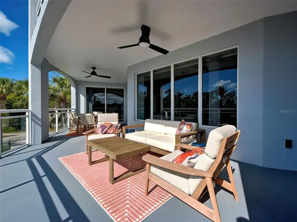 a kitchen with stainless steel appliances kitchen island granite countertop a sink and a cabinets