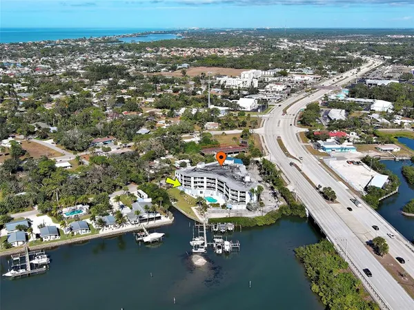 a kitchen with stainless steel appliances kitchen island granite countertop a stove and a sink