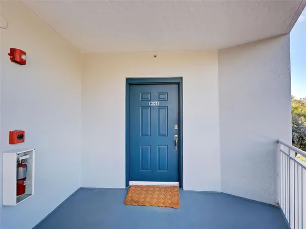a view of a hallway and wooden floor and a dining room