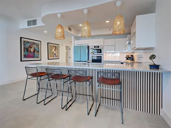 a room with furniture and painting on the wall