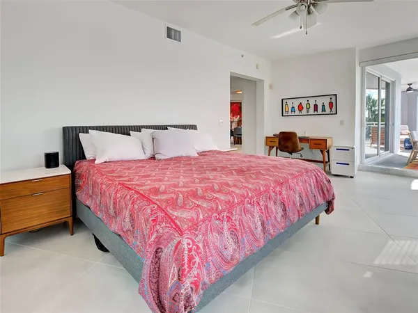 a bedroom with a bed and a cabinets