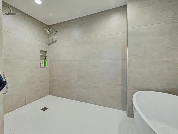 a front view of a building with a garden