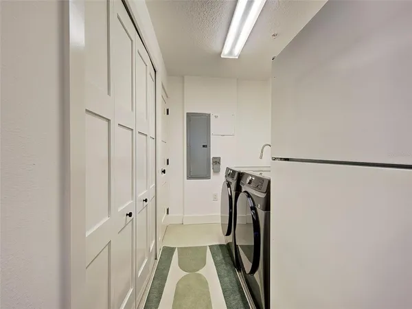 an aerial view of residential building and lake