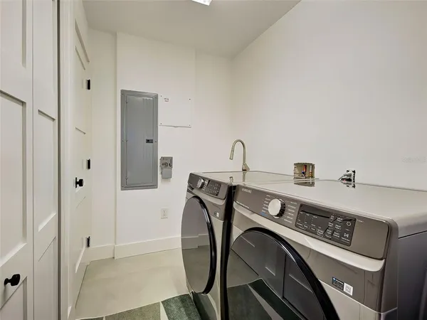 a view of a garage with furniture and cars