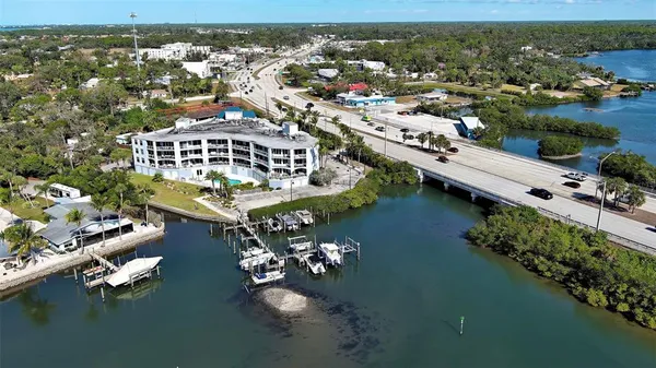 an aerial view of a city with ocean view