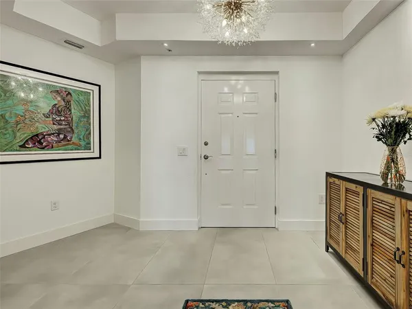 a living room with furniture and a pool table