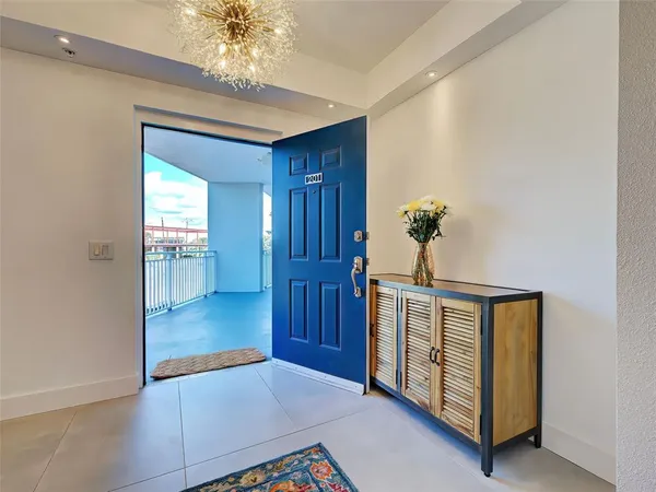 a room with furniture pool table and windows