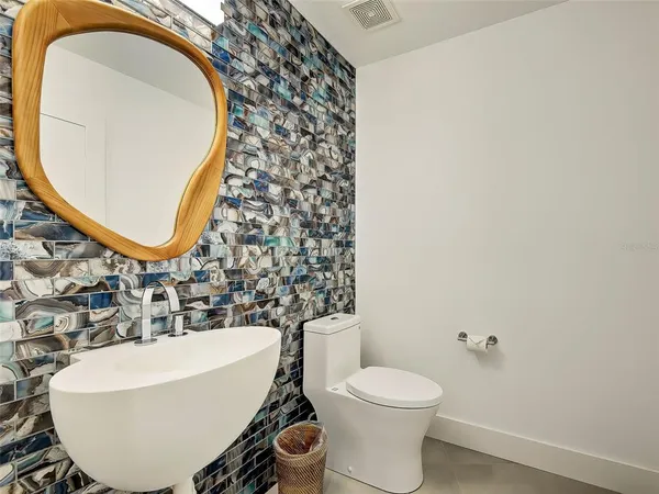 a kitchen with stainless steel appliances a stove a sink and a microwave