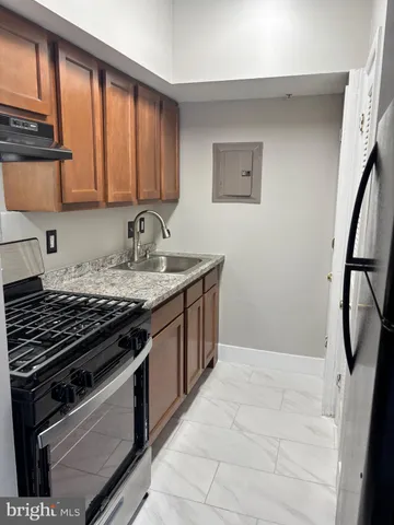 a kitchen with a stove and a sink