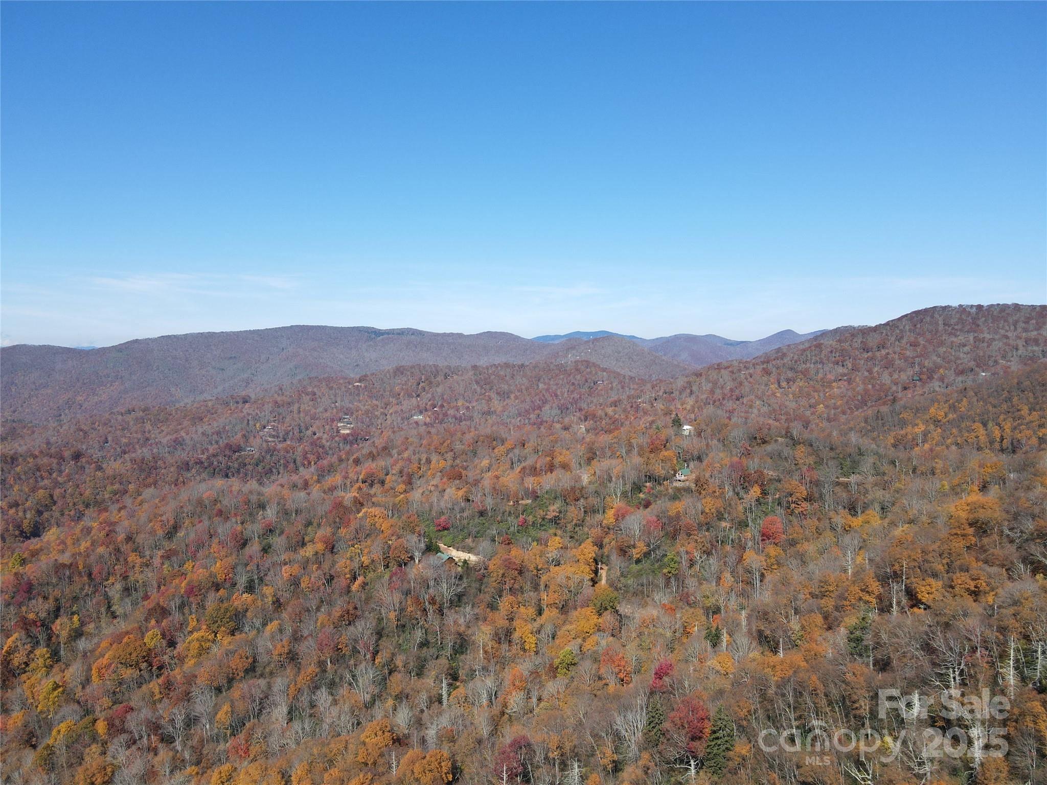 3689 Plott Balsam Road Maggie Valley, NC 28751 - Photo 16 of 33 a view of a mountain range in a cloudy sky