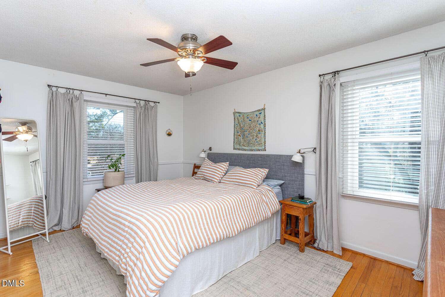 3200 Fairforest Place Raleigh, NC 27604 - Photo 13 of 40 a bedroom with a bed and a chandelier
