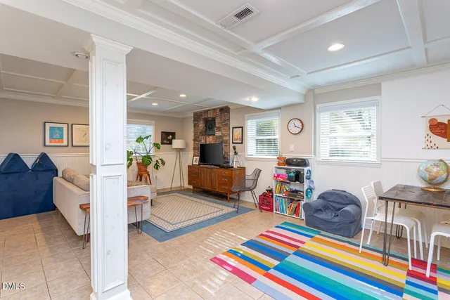 a living room filled with furniture and a table