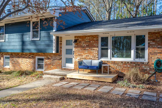 a view of house with outdoor seating